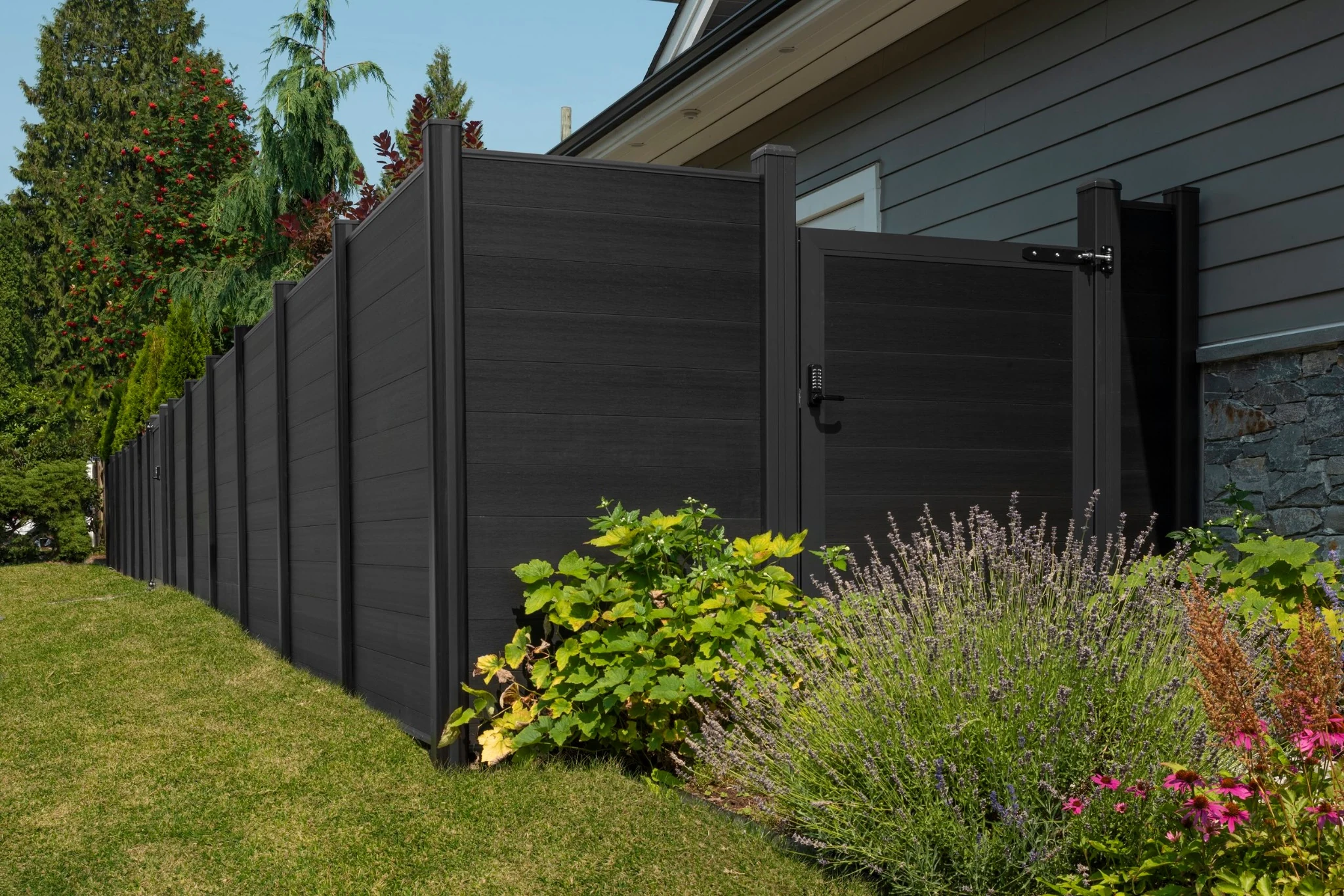Onyx Black full privacy composite fencing and matching gate at the Garrow project in Port Moody